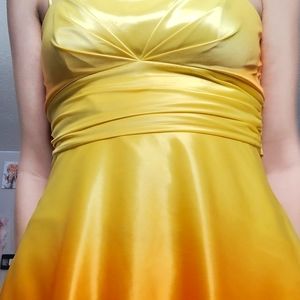 Orange and yellow sparkley dress with back bow
